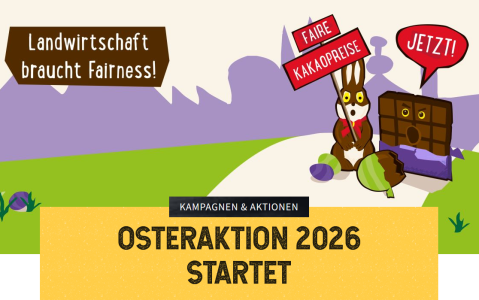Illustration zur Osterkampagne: Ein Hase hält ein Schild „Faire Kakaopreise“, daneben eine sprechende Schokoladentafel mit „Jetzt!“. Im Hintergrund steht „Landwirtschaft braucht Fairness!“. Darunter der Titel: „Kampagnen & Aktionen – Osteraktion 2026 startet“. Die Szene spielt in einer bunten Landschaft.